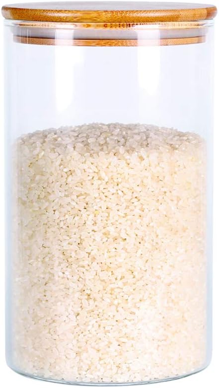 Borosilicate glass food storage jar with bamboo lid filled with rice