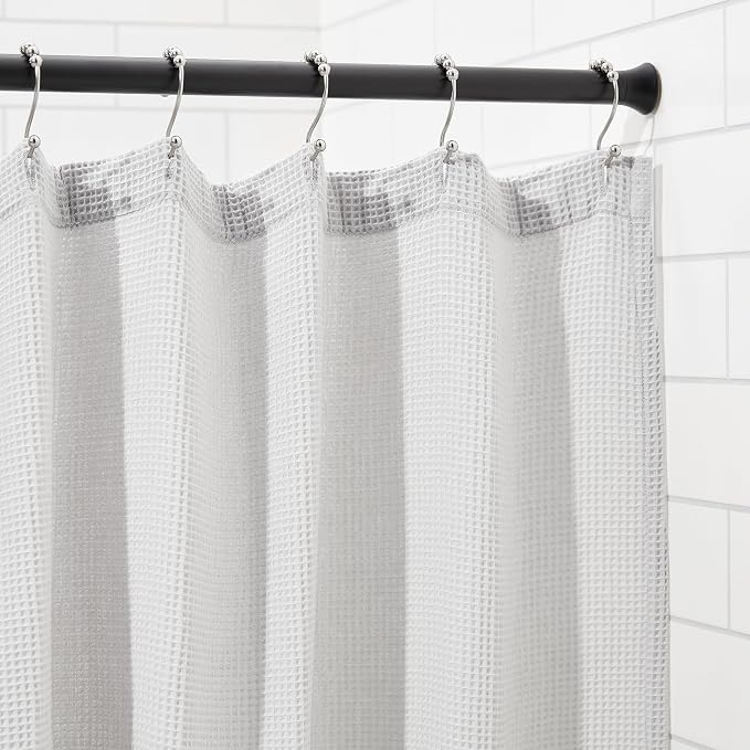 Amazon Basics Adjustable Sturdy Spring Tension Curtain Rod, No Drilling/No Holes, 36-54", Black, Classic Finial